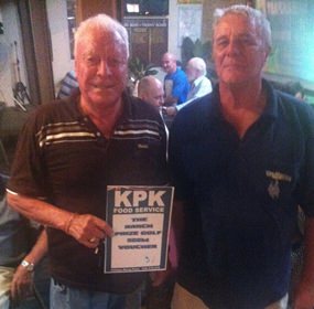 Reg Smart presents the KPK voucher to medal champion Peter Habgood.