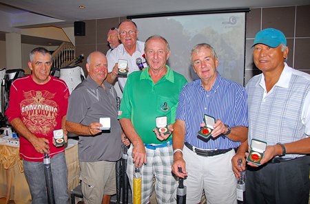 Near pin winners show off their Poppy Golf medals.