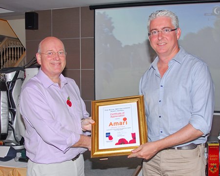 Graham MacDonald MBE, President of the Royal British Legion, (left) presents a certificate of appreciation to Brendan Daly, General Manager of the Amari Orchid Resort Pattaya.