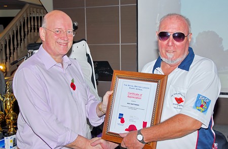 The work of tireless organizer Max (right) is recognized by the Royal British Legion.