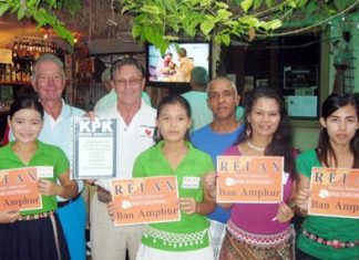 Friday winners pose for a photo with staff at The Relax Bar.