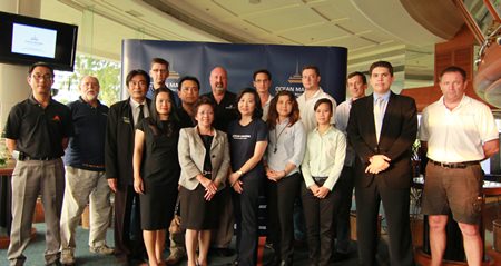 Deputy Mayor Ronakit Ekasingh (back row, third from left), Pataraporn Sithivanich (front row, second from left), Executive Director, Product Promotion Department, Tourism Authority of Thailand; Supatra Angkawinijwong (front row, third from left), Deputy Managing Director, Ocean Property, and Scott Finsten (back row, sixth from left), Harbour Master, Ocean Marina Yacht Club, together with exhibitors.