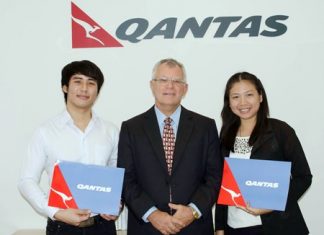 Qantas raffle tickets at Education Expo Qantas Manager for Thailand and Vietnam Bob Everest (centre) is seen presenting return Qantas Economy tickets, Bangkok-Australia-Bangkok to Sirapath Angsopasirikul (left) and Tritsana Sorat (right), lucky winners of OCSC International Education Expo 2013.