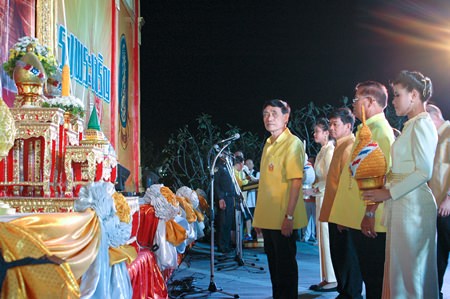 Thawit Chaiswangwong, chairman of the Pattaya city council leads city councilors in placing their auspicious ornaments.