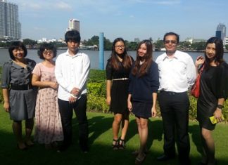 Sarah and Yeen, together with their families, at the Cambridge Outstanding Learner Awards in Bangkok.