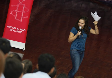 An Amnesty worker talks to GIS students in special assemblies.
