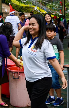 Ann lines up to soak a teacher.