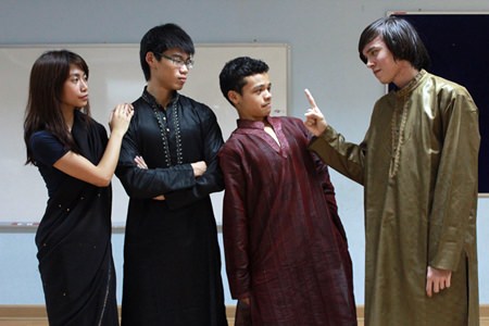 A grumpy IB student acts out a part.