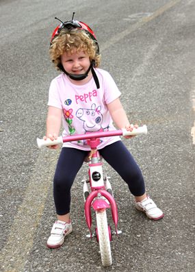 Saoirse, aged 4, peddles an impressive 5 km towards the Regents ‘Pattaya to Philippines’ Challenge.