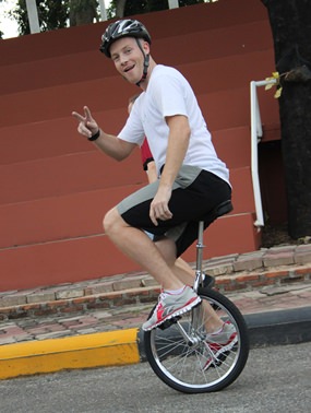 Mr Reardon shows off his skills on a unicycle!