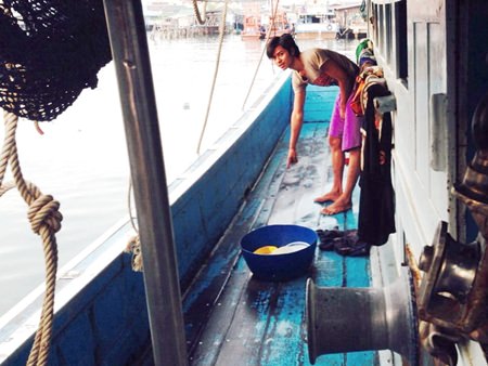A fellow crewman points to where the deceased had been cleaning the boat when electrocuted.