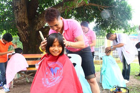 Children are truly enjoying hair treatments from Jutamat Beauty School beauty technicians.