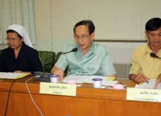 Principal Udomchok Churat (center) provides an update on various projects at the Redemptorist Center.