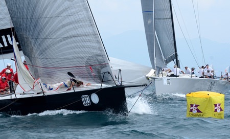 OneSails Racing (left) reaches the mark ahead of Oil in the IRC0 class.