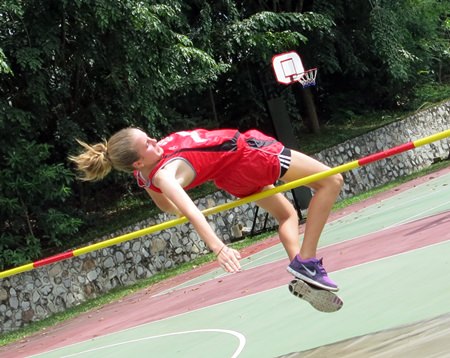A Regents high jumper leaps for a medal position.