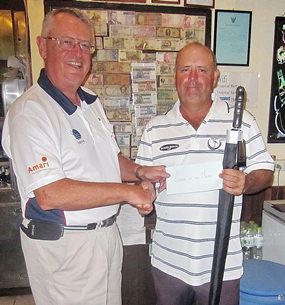 Dick Warberg (left) presents the MBMG Golfer of the Month award to  Bob Watson.