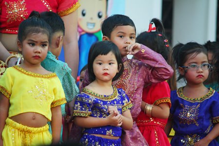 Perhaps not quite sure what is going on, these youngsters prepare to perform their dances on stage.