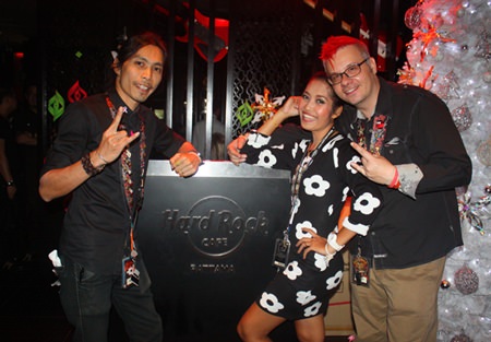 Matthew Carley, manager, along with Hard Rock Cafe staff, present the familiar Hard Rock pose on New Year’s Eve.