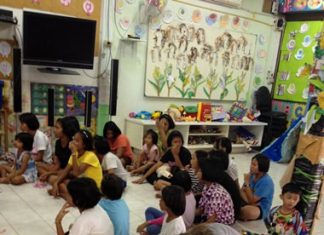 Children gather to hear Ms. Margaret read wonderful stories from the bible.
