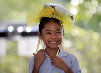 A Primary student from GIS looks great in her own special hat.