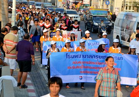 Organizations, students and hotel workers show their support for the effort during a march down Beach Road.
