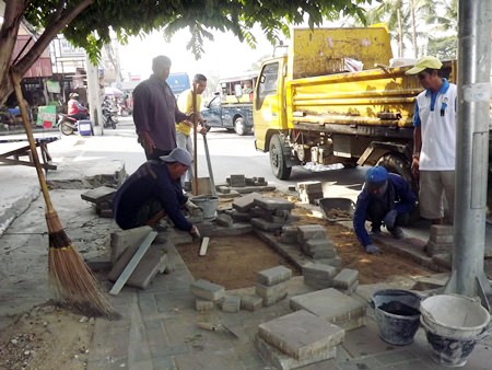 City workers are hard at work, replacing broken tiles and filling holes in the sidewalks throughout Pattaya.