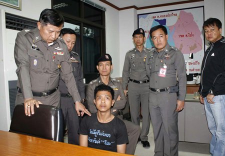 Prajak Masawang (seated) could face the death penalty for the gruesome murder of 2 young boys and their cousin / baby sitter.