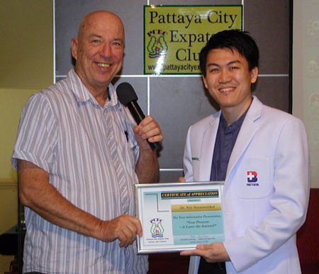 MC Roy Albiston presents Dr Niti with a Certificate of Appreciation from PCEC as thanks for his presentation, which was of benefit to over half the audience.