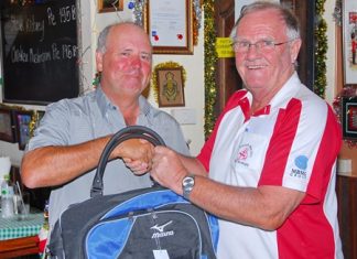 Bob Watson (left) is presented with the MBMG Group Golfer of the Month award by Derek Brook.