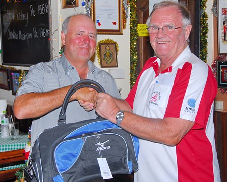 Bob Watson (left) is presented with the MBMG Group Golfer of the Month award by Derek Brook.