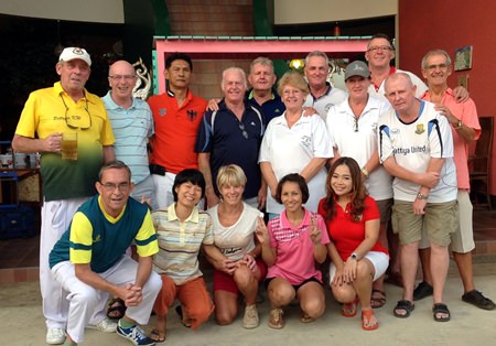 The teams pose for a group photo.