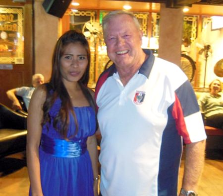 A happy 50/50 winner with Golf Chairman Joe Mooneyham.