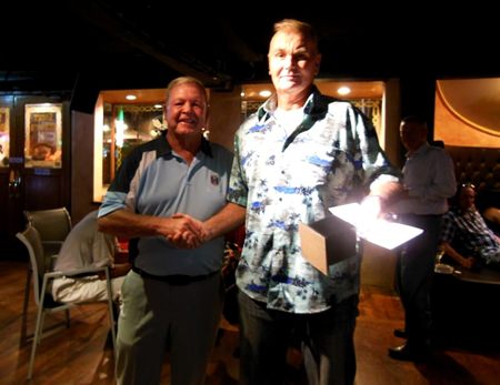 Golf Chairman Joe Mooneyham (left) congratulates A Flight overall winner Jeff Wylie.