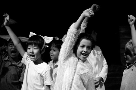 Wilbur cheers amongst his farmyard friends.