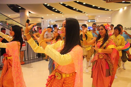 Thai traditional dancers gracefully perform as part of the long-drum procession - a Thai wedding tradition.