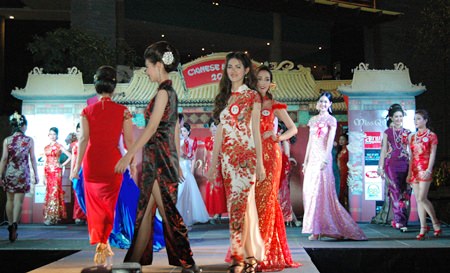 Contestants strut their beautiful Qipao fashions along the catwalk.