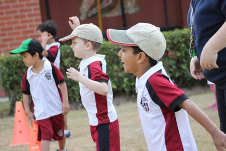 Early Years’ students cheer for their fellow team mates!