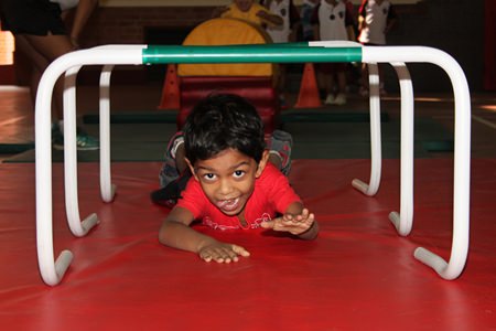 Regents’ student shows great concentration as he takes on the Early Years’ obstacle course.