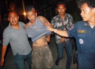 Authorities were finally able to extract the crazed Chanok Suwan from his house after his failed suicide attempt.