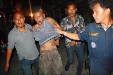 Authorities were finally able to extract the crazed Chanok Suwan from his house after his failed suicide attempt.