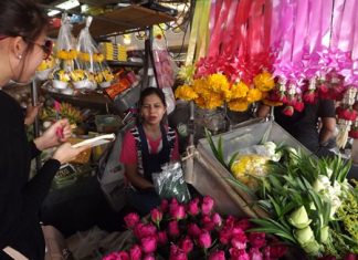 Kan Janwichian sells pink and red roses at prices starting at 20-25 baht at her flower stand at the Chaimongkol Temple market in South Pattaya.