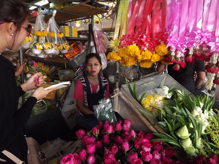 Kan Janwichian sells pink and red roses at prices starting at 20-25 baht at her flower stand at the Chaimongkol Temple market in South Pattaya.