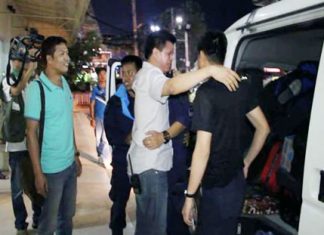 Superintendent Col. Supachai Phuikaewkhum breaks down in tears as he welcomes home local officers who had been deployed to the demonstrations in Bangkok.