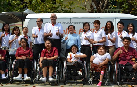 FWD Life Insurance Co. CEO Mike Plaxton (center) led his company to donate 10 wheelchairs to the Redemptorist Vocational School for Persons with Disabilities.