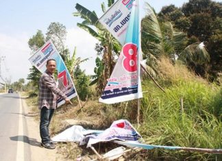 Rattanahcai Saengsri points out that that posters for three of six candidates in the Feb. 16 poll were shredded on Soi Wat Khaokhanman at the Yuttasart intersection.