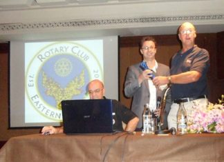 Nigel Quennell (center) presents a token of thanks to Michael Todd-White (right).