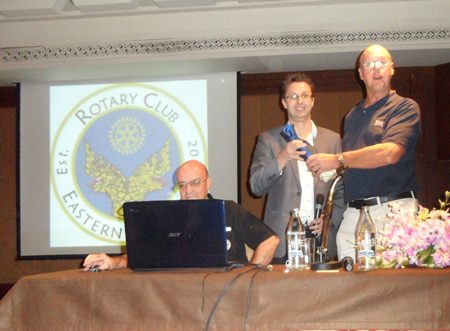 Nigel Quennell (center) presents a token of thanks to Michael Todd-White (right).