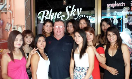 ‘Second-Hand’ Bob (center) celebrates his win with the staff at Blue Sky Bar.