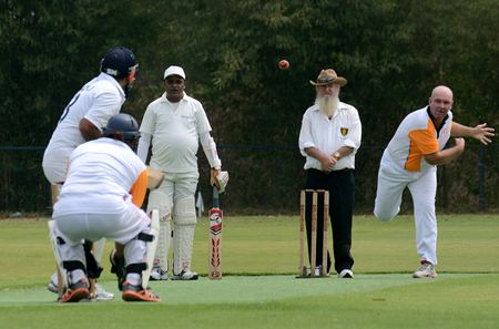 Pattaya Cricket Club’s John Spiers (right) bowls one of the tense final few overs against Indorama at the Thai Polo Club, Sunday, Feb. 16.