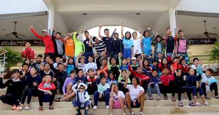The 58 young sailors pose for a group photo at Royal Varuna Yacht Club in Pattaya.